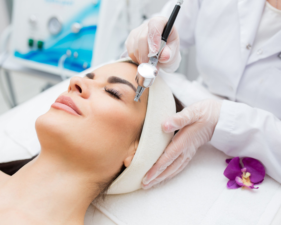 closeup-view-womans-head-receiving-diamond-microdermabrasion-treatment-skin-care-profession